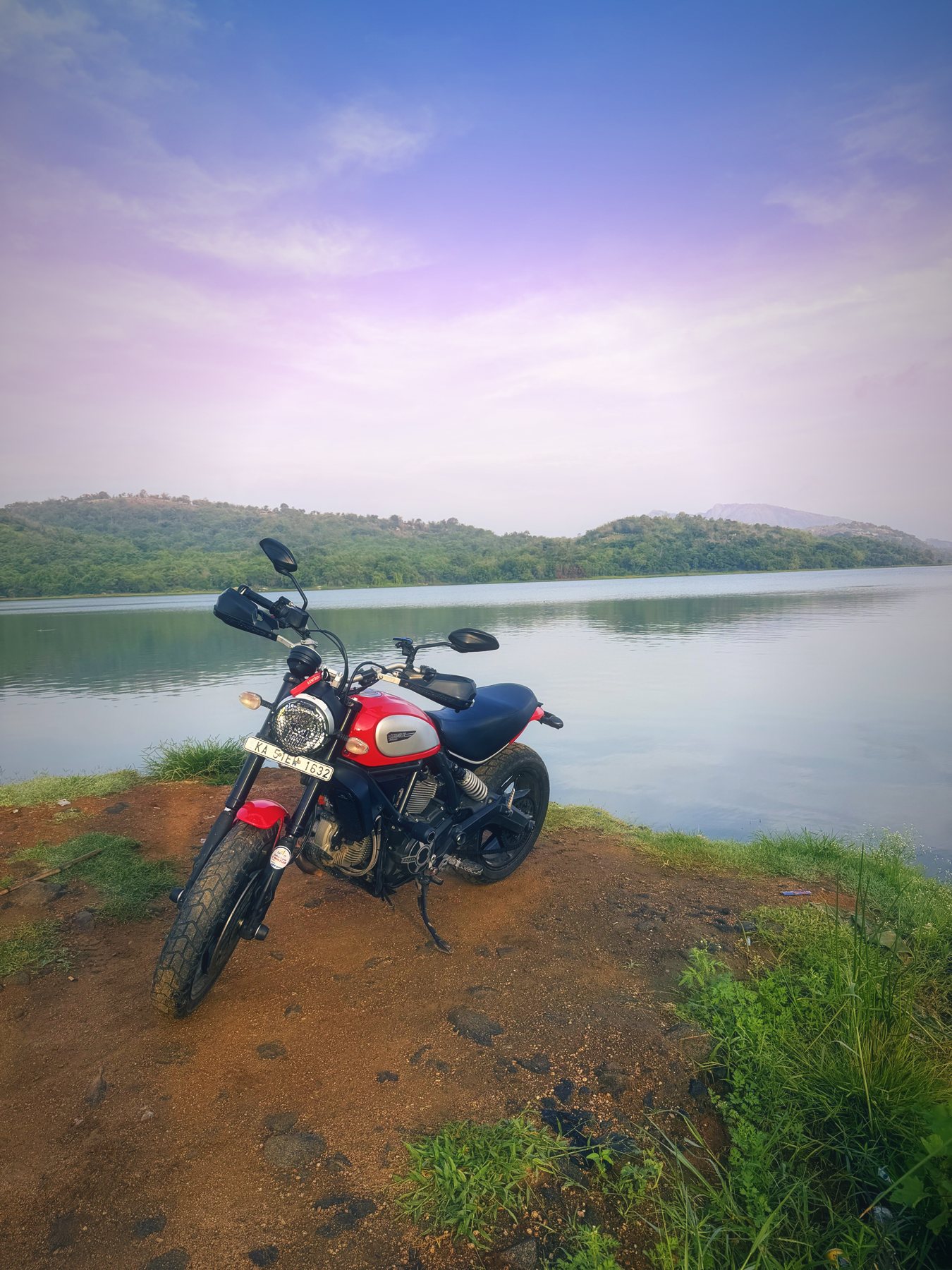 Portrait view across the reservoir, with Savandurga faint on the horizon